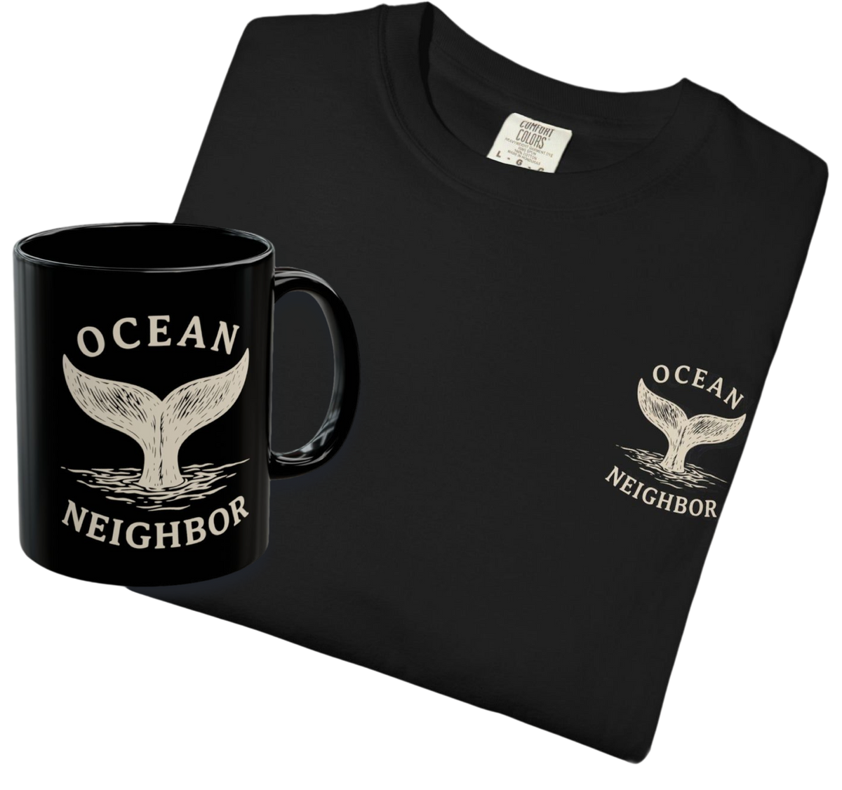 A black folded T-shirt and matching black mug with a white whale tail graphic and the words 'OCEAN NEIGHBOR' on a plain white background.