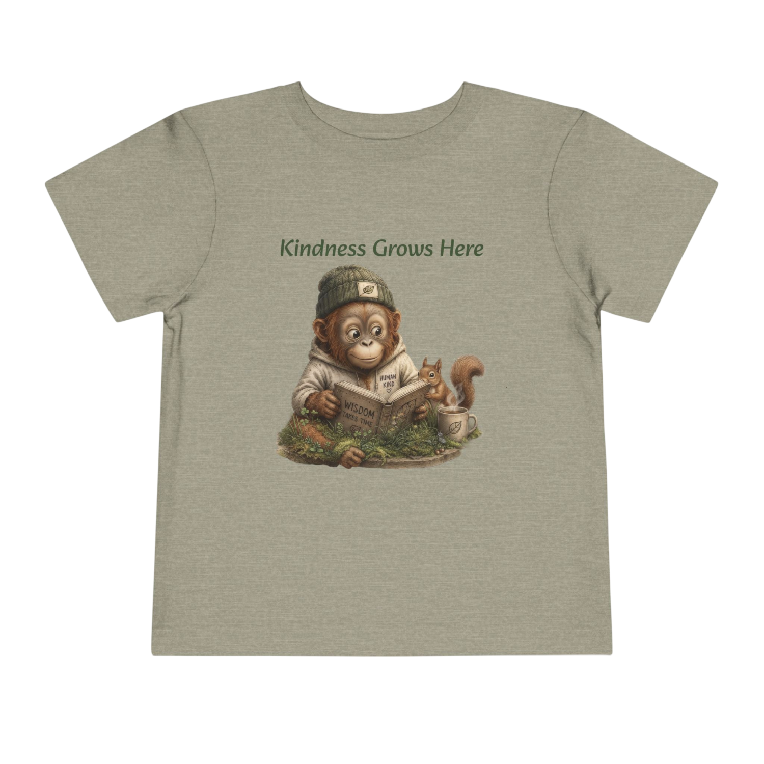 A heathered sage green short-sleeve t-shirt with a graphic of a monkey reading a book and a squirrel, with the text 'Kindness Grows Here' above the illustration, shown on a plain white background.