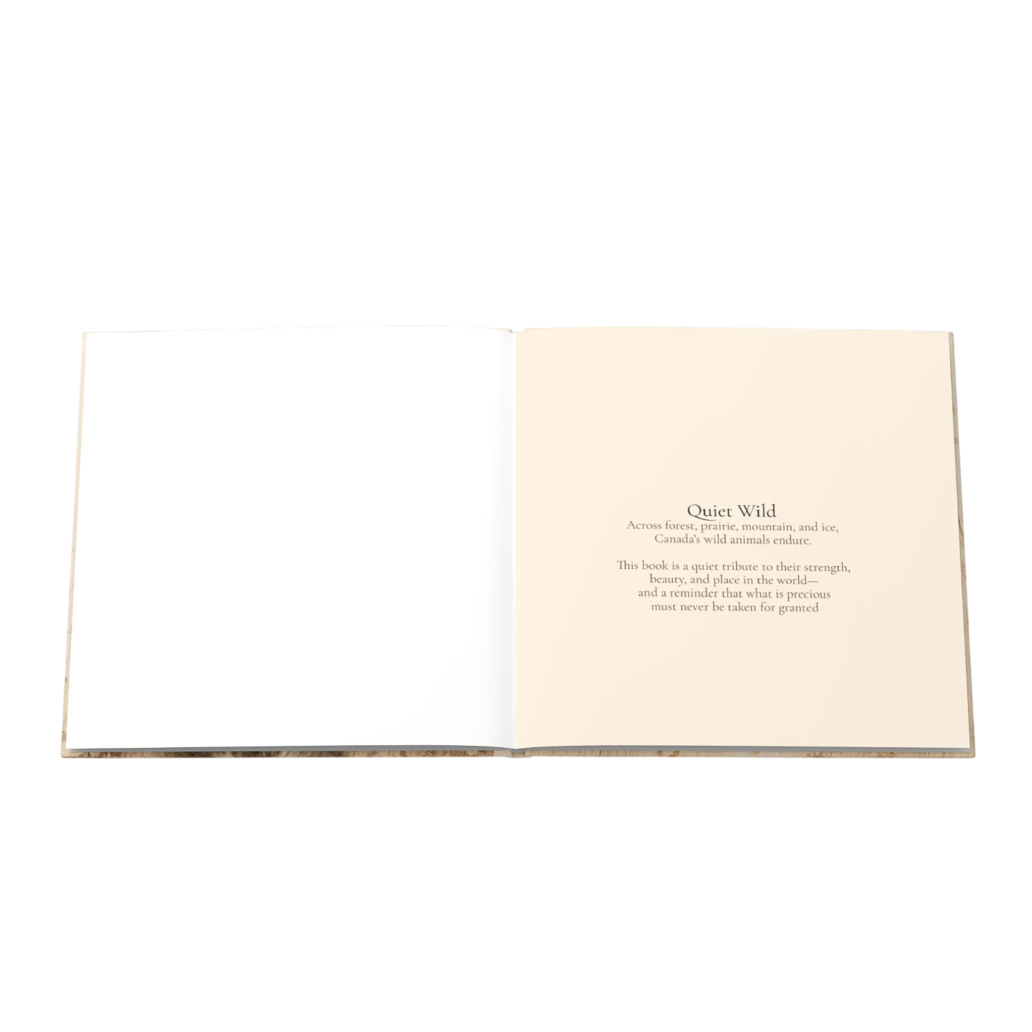 An open hardcover book laid flat on a white background, showing an empty left page and a cream-colored right page with printed text titled 'Quiet Wild.'.