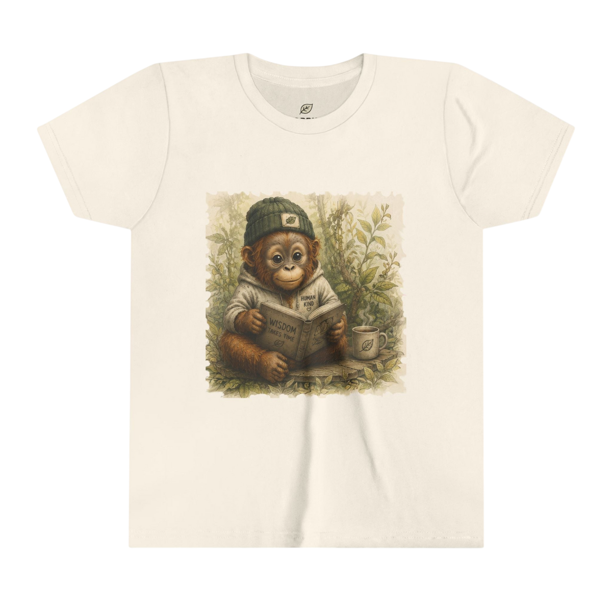 An off-white short-sleeve crewneck t-shirt featuring a central graphic print of a cute cartoon monkey wearing a green cap and reading a book in a garden setting.