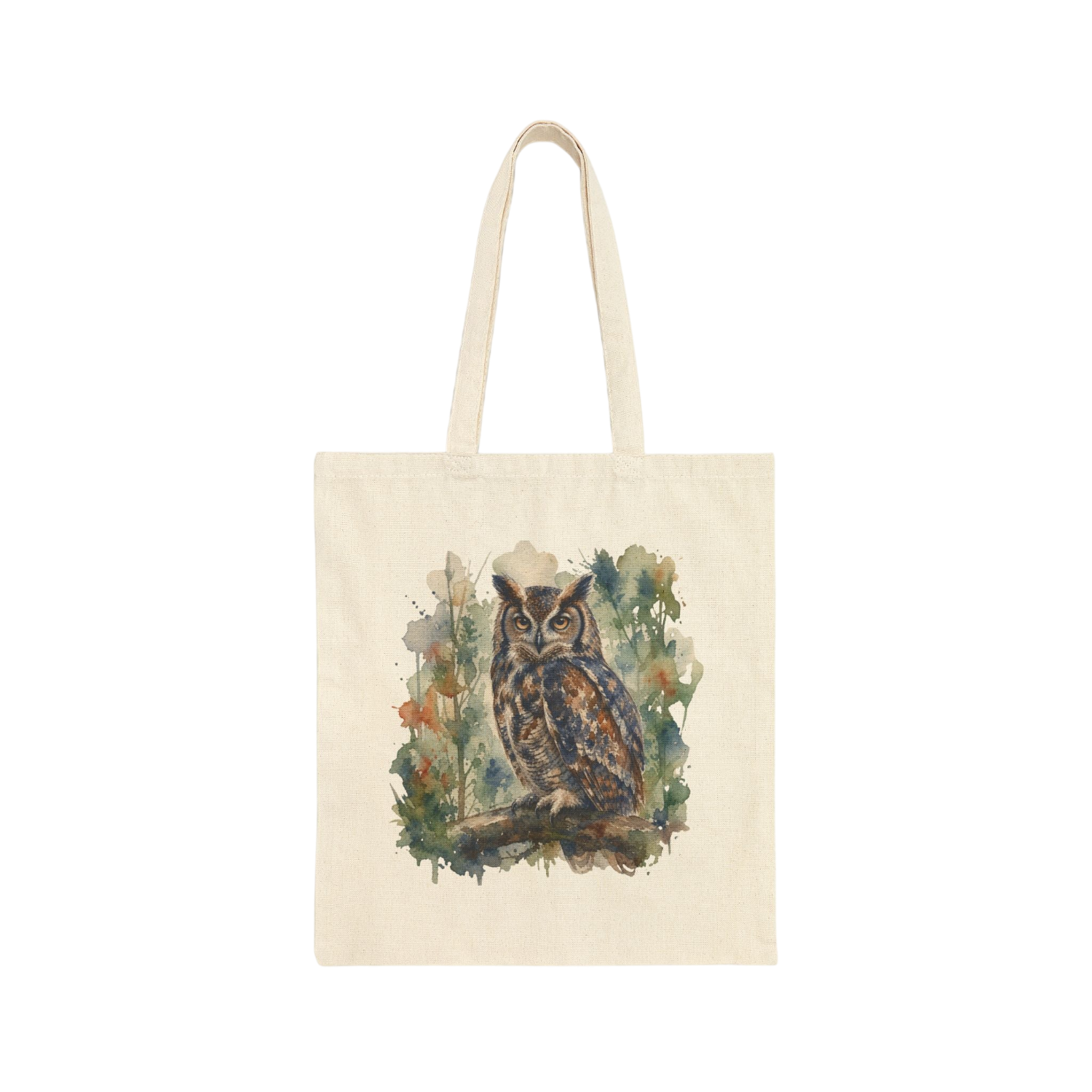 An off-white canvas tote bag with long handles, featuring a watercolor-style illustration of a brown owl surrounded by green and blue foliage on the front, set against a plain white background.