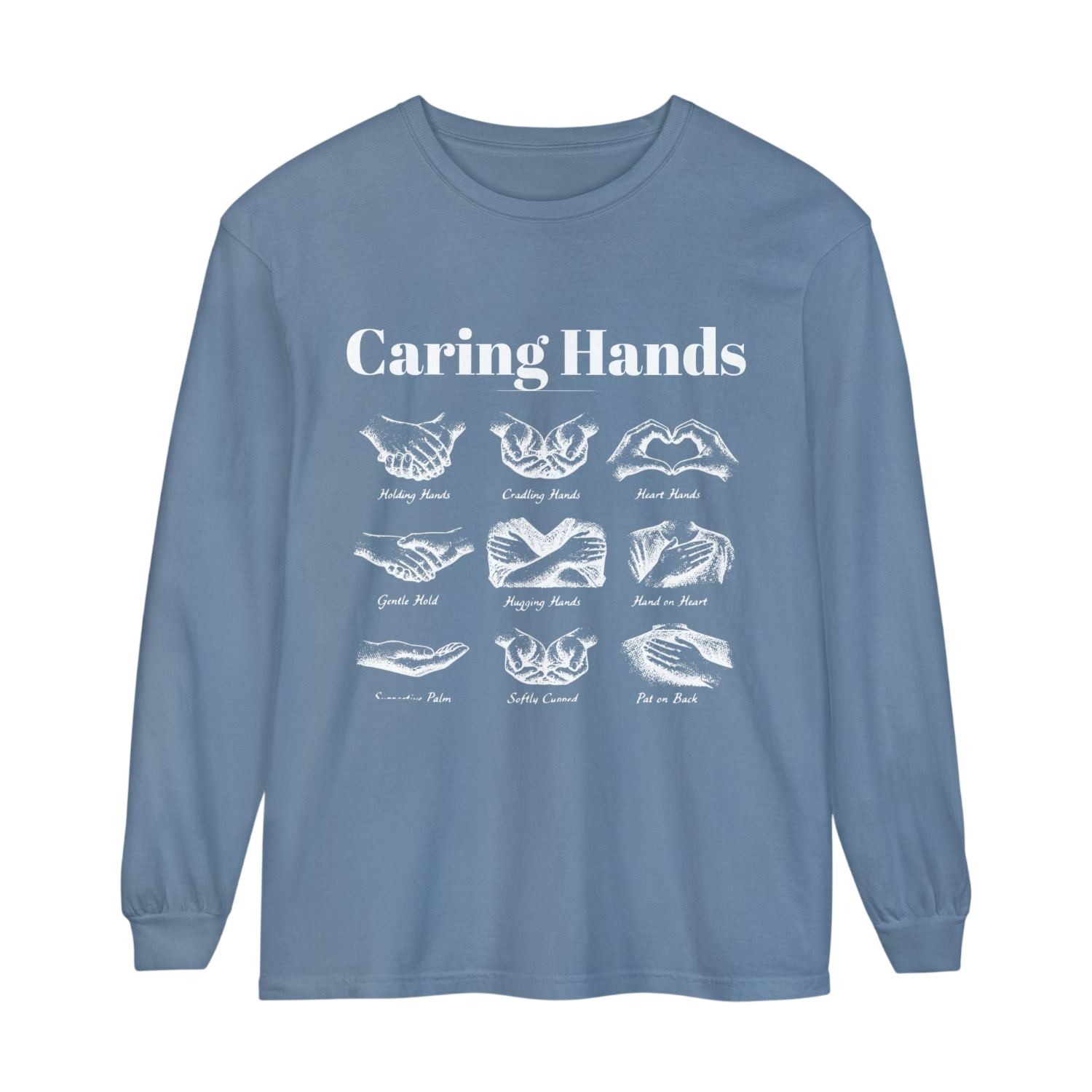 A dusty blue long-sleeve t-shirt with a white graphic print on the front titled 'Caring Hands', displaying twelve different hand gestures and their names underneath.