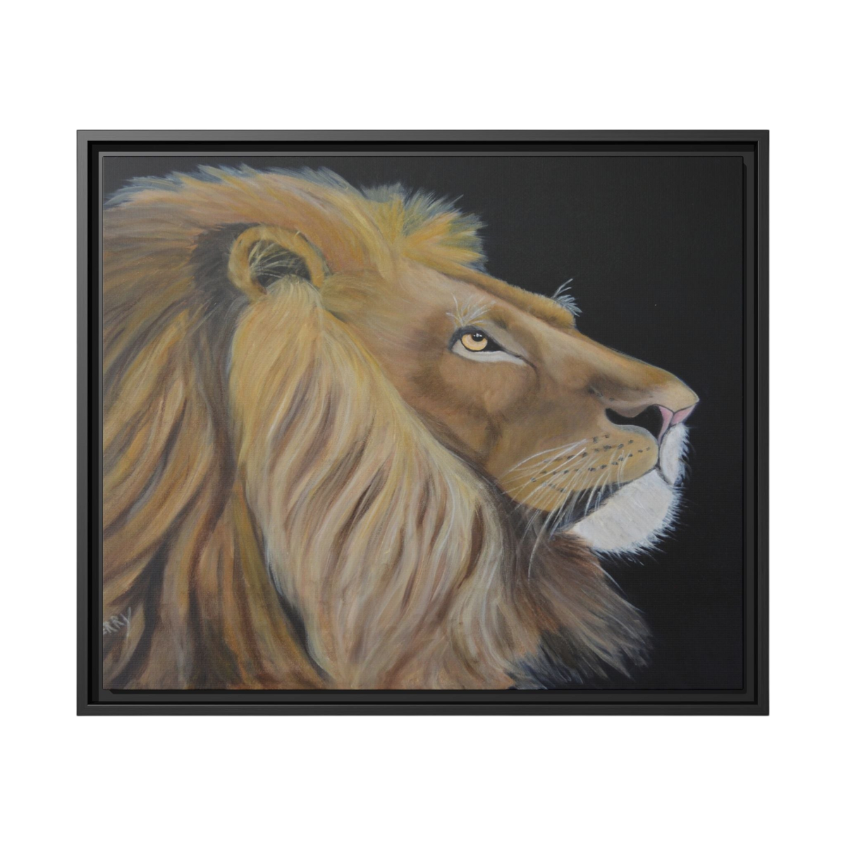 A framed portrait painting of a male lion in profile against a dark background, shown in a black frame on a white studio background.