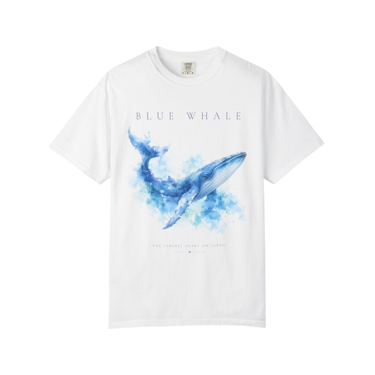 A white short-sleeve crewneck t-shirt featuring a blue watercolor whale graphic on the front, with the text 'BLUE WHALE' printed above the illustration.