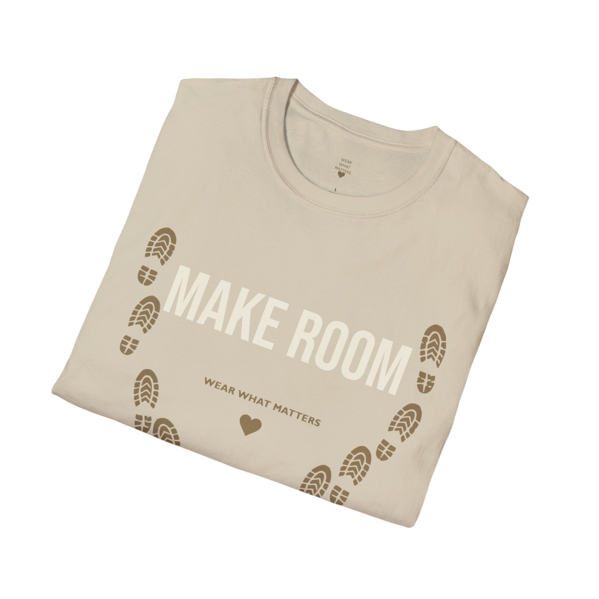 A folded beige t-shirt with a brown graphic print that reads 'MAKE ROOM' and 'WEAR WHAT MATTERS' with footprints, shown on a solid white background.